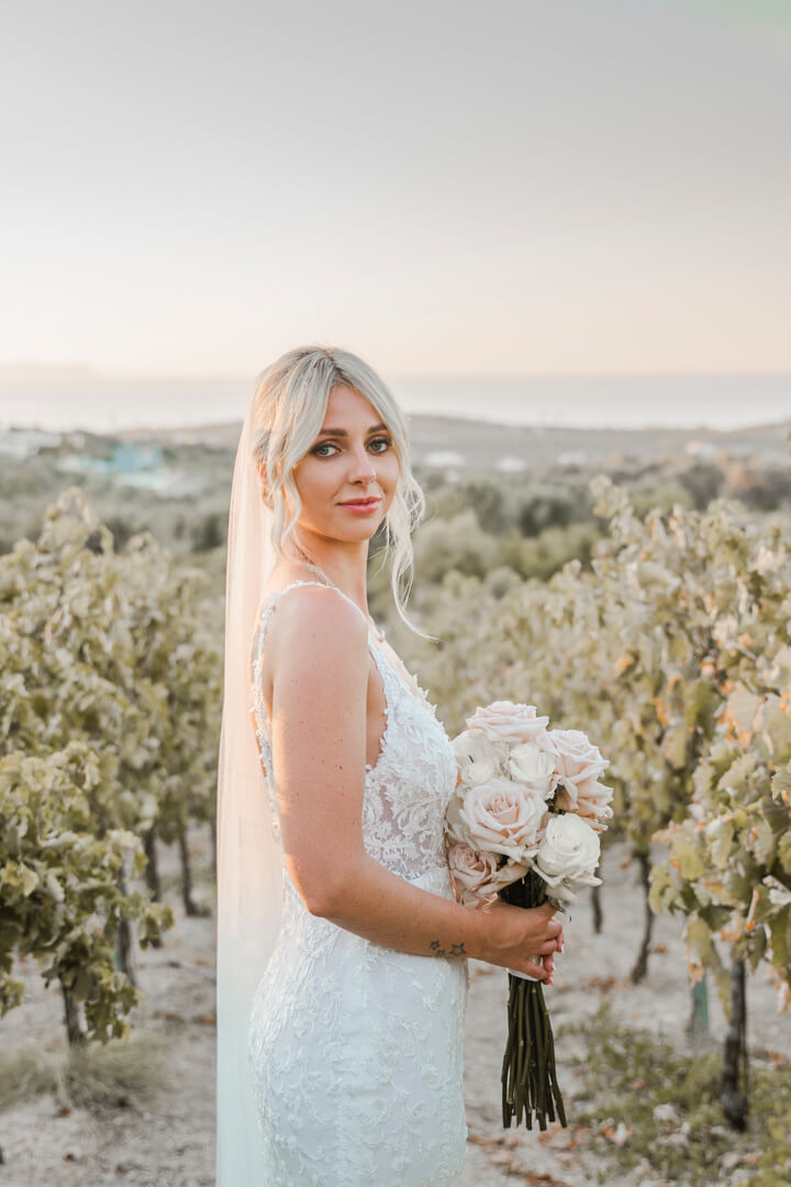 bride in vineyards in Agreco Farms wedding venue in Crete